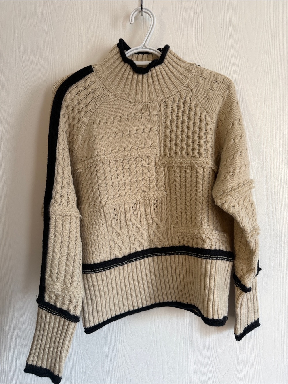 Cream Cable-Knit Turtleneck Sweater with Black Trim